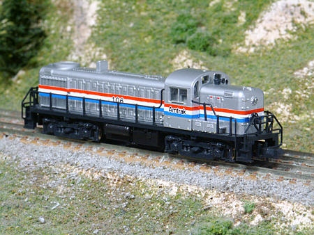 Kato RS-3 custom painted in Amtrak phase III. 